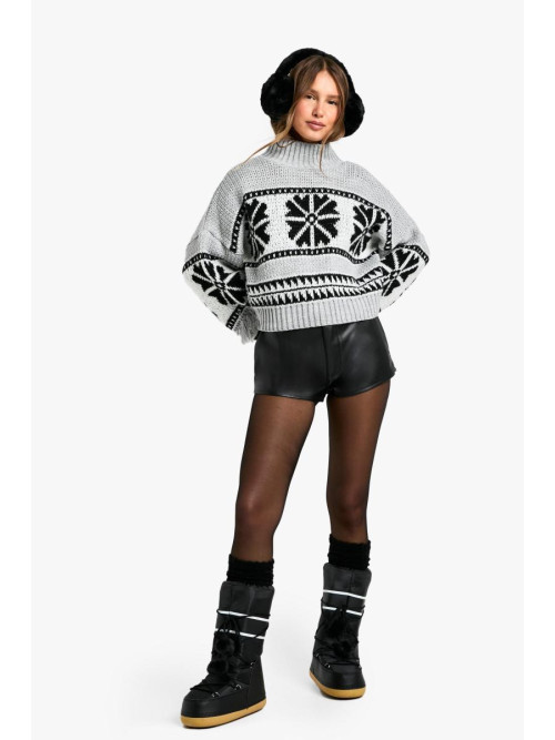 Великий джемпер у формі сніжинки з високим горлом і китицями