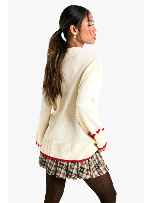 Величезний різдвяний джемпер із сердечками та бантом